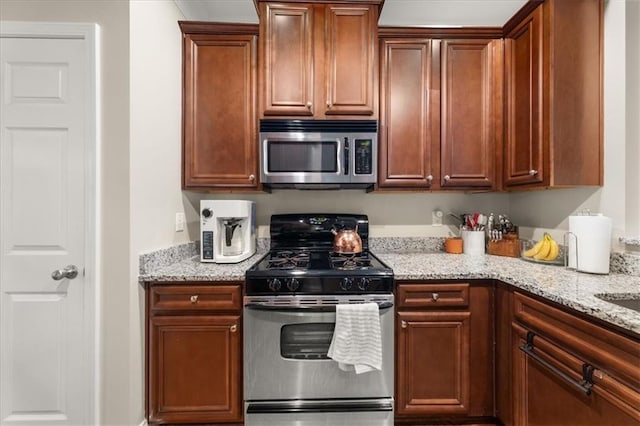 3937 Covey Flush Ct SW Unit 25, Smyrna, GA 30082 - kitchen with appliances with stainless steel finishes and light stone counters
