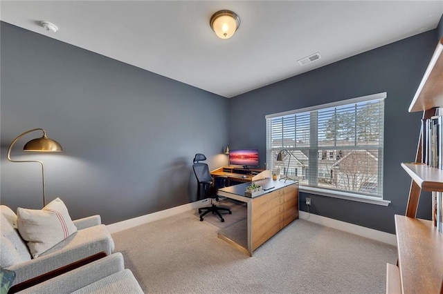 home office featuring light carpet, baseboards, and visible vents