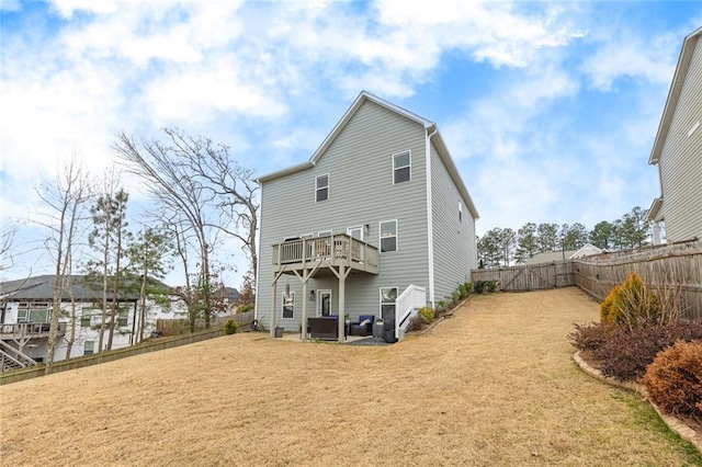 back of property featuring an outdoor hangout area, a lawn, and a fenced backyard