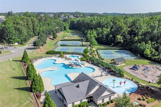 birds eye view of property featuring a wooded view