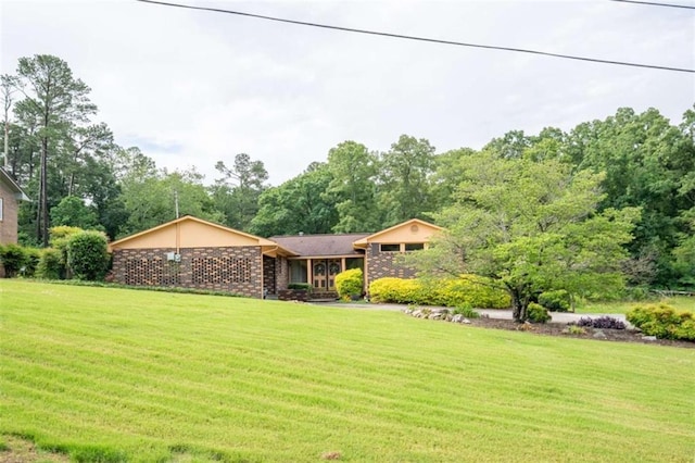 268 Tuck St, Cedartown, GA 30125 - view of front of house featuring a front yard and brick siding