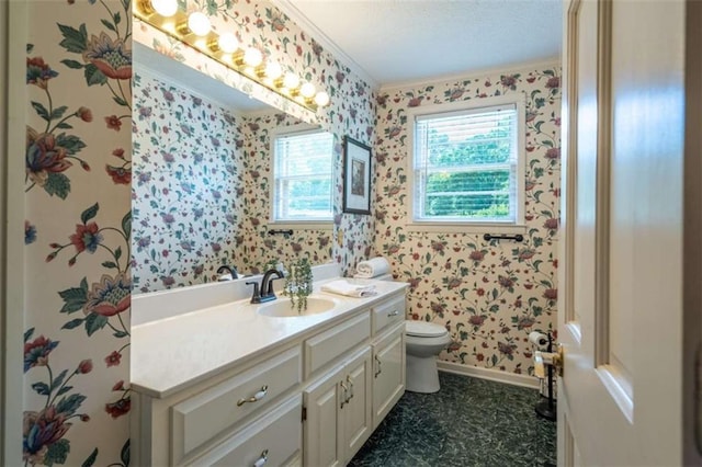 268 Tuck St, Cedartown, GA 30125 - bathroom with wallpapered walls, ornamental molding, toilet, vanity, and baseboards