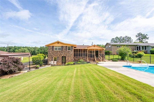 268 Tuck St, Cedartown, GA 30125 - back of property featuring a sunroom, brick siding, and a patio