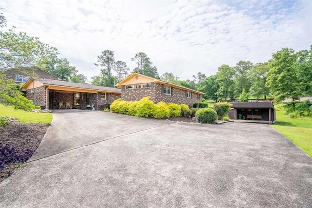 268 Tuck St, Cedartown, GA 30125 - view of front of property featuring concrete driveway and brick siding