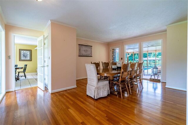 268 Tuck St, Cedartown, GA 30125 - dining area with wood finished floors, ornamental molding, and baseboards