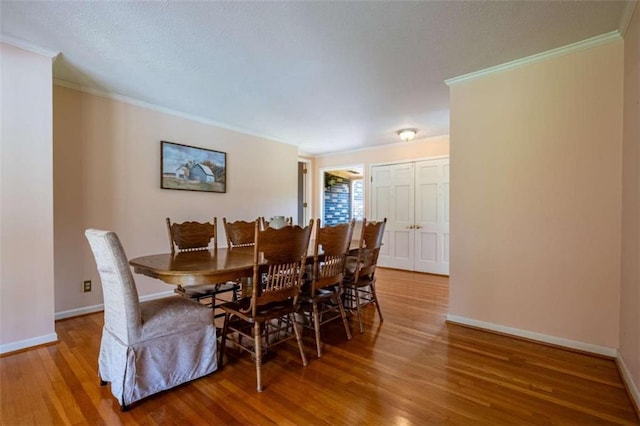 268 Tuck St, Cedartown, GA 30125 - dining area with wood finished floors, crown molding, and baseboards