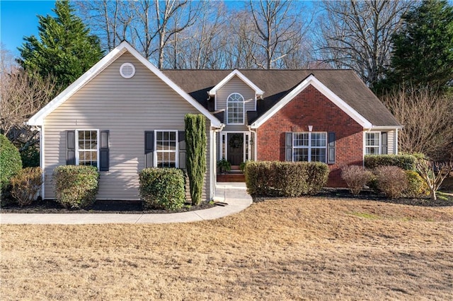 traditional-style home featuring brick siding