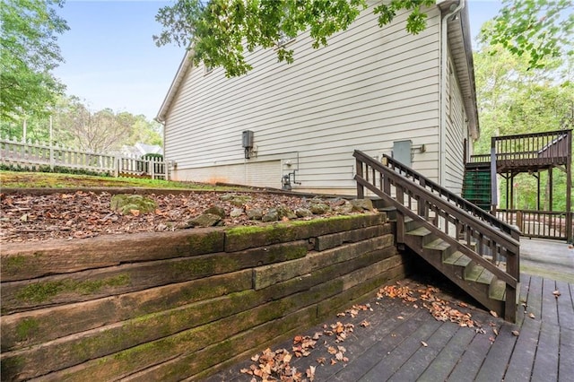 view of side of home with a wooden deck