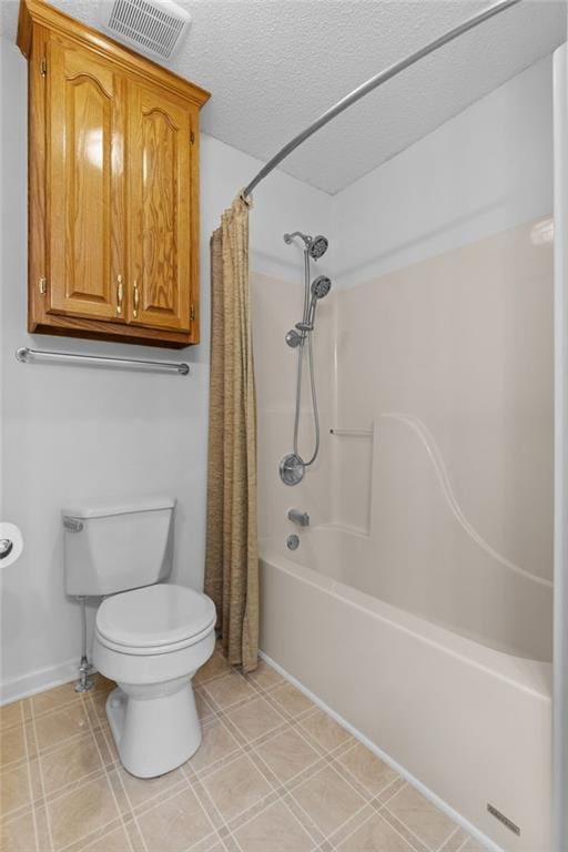 bathroom with toilet, a textured ceiling, and shower / bath combo with shower curtain