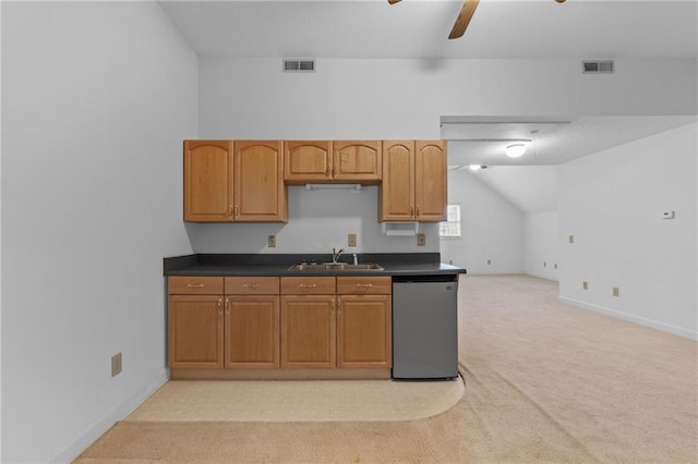 kitchen with dishwasher, lofted ceiling, light colored carpet, ceiling fan, and sink