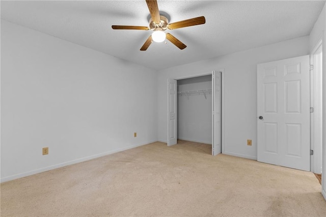 unfurnished bedroom with a closet, ceiling fan, and light carpet