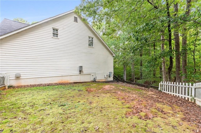 view of home's exterior with a lawn