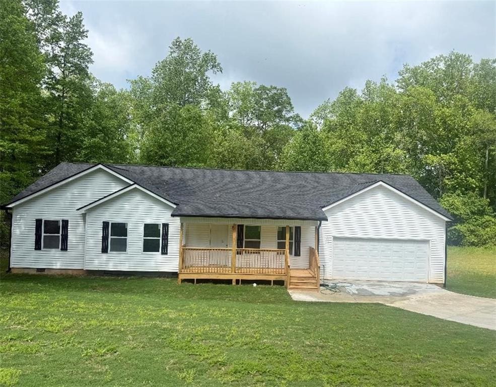 191 Deerfield Ln, Carrollton, GA 30116 - view of front of property featuring a porch, a front lawn, a garage, and driveway