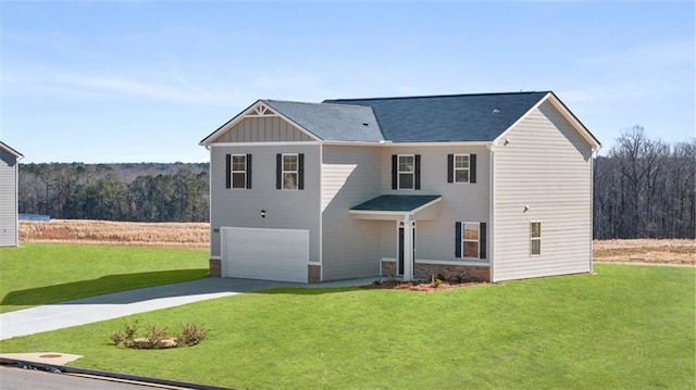 view of front of home with an attached garage, concrete driveway, a front yard, and board and batten siding