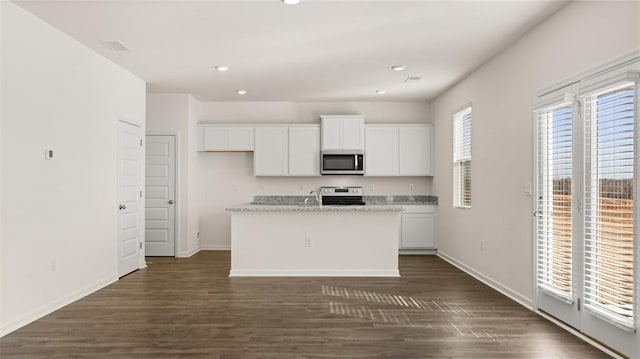 kitchen featuring stainless steel appliances, white cabinets, dark wood-type flooring, baseboards, and recessed lighting