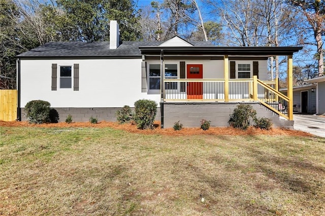 view of front of home featuring a front yard and a porch