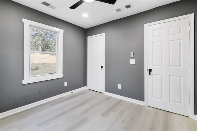 spare room featuring ceiling fan and light wood-type flooring