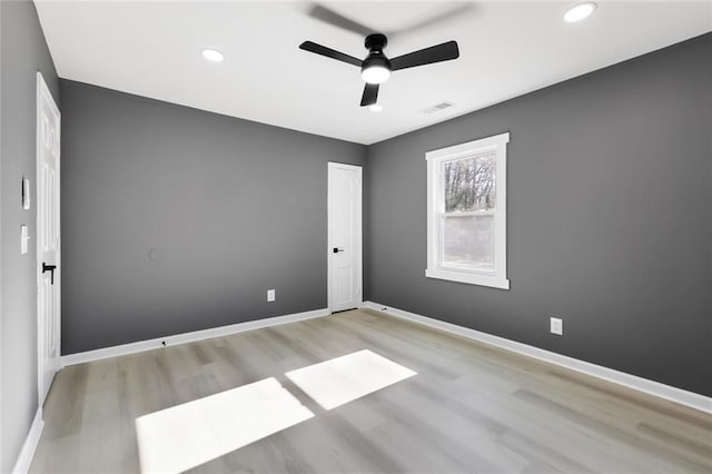 unfurnished room featuring ceiling fan and light hardwood / wood-style floors