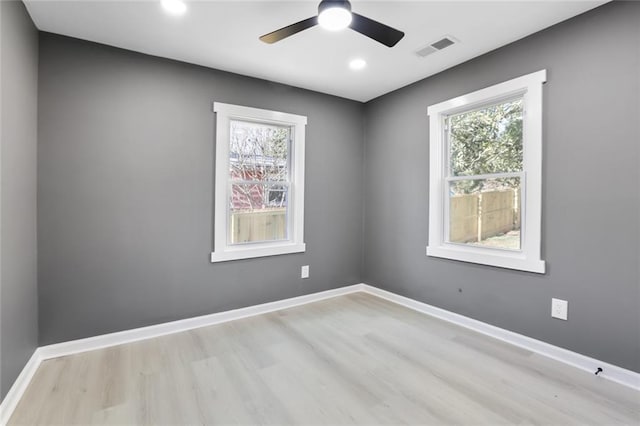 empty room with light hardwood / wood-style floors and ceiling fan