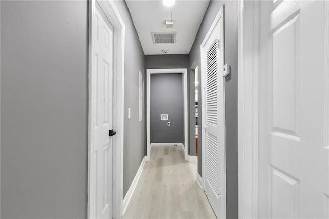 hall with light hardwood / wood-style flooring