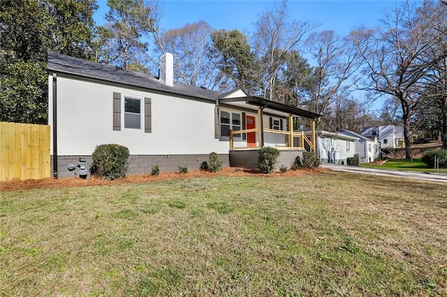 ranch-style home with a porch and a front yard