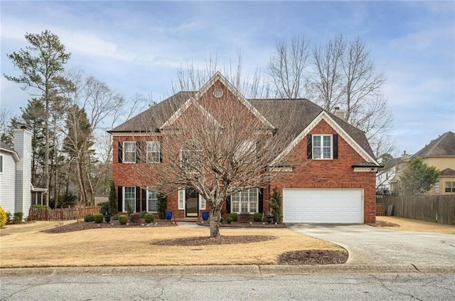 colonial home featuring a garage, brick siding, fence, concrete driveway, and a chimney