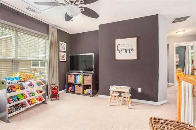 recreation room featuring visible vents, carpet flooring, baseboards, and ceiling fan