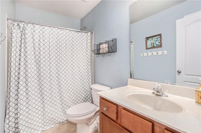 bathroom with vanity, tile patterned flooring, toilet, and curtained shower