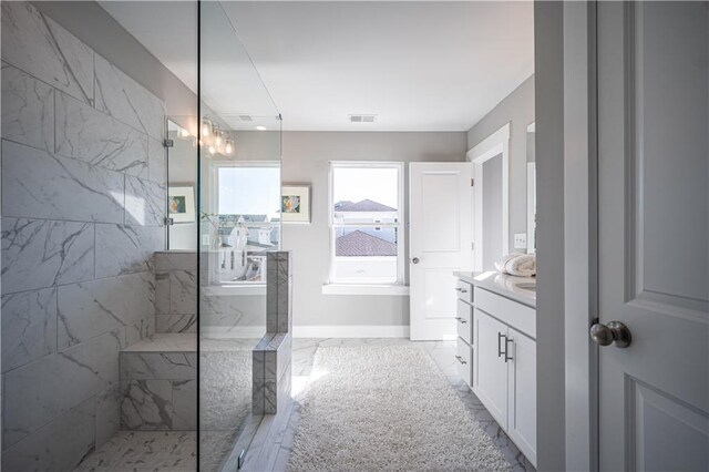 bathroom with an enclosed shower, tile flooring, and vanity