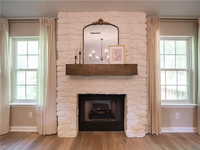 803 Plantation Ridge Overlook, Woodstock, GA 30188 - detailed view of wood finished floors, a chandelier, and baseboards
