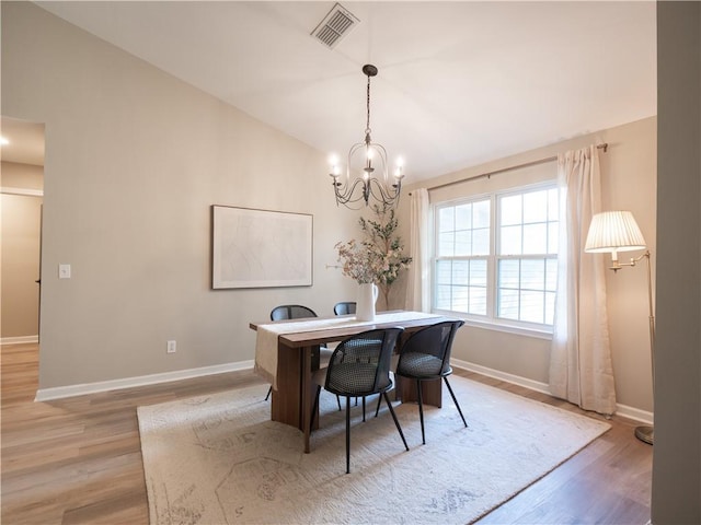 803 Plantation Ridge Overlook, Woodstock, GA 30188 - dining space featuring baseboards, light wood finished floors, lofted ceiling, a chandelier, and a desk