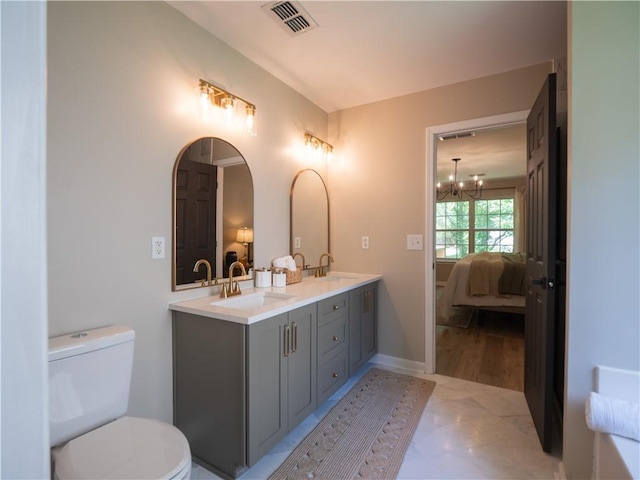 803 Plantation Ridge Overlook, Woodstock, GA 30188 - bathroom with ensuite bath, double vanity, a chandelier, and toilet
