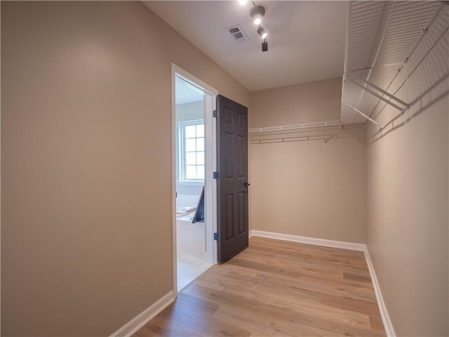 803 Plantation Ridge Overlook, Woodstock, GA 30188 - walk in closet with light wood-style flooring