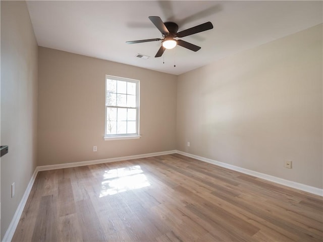 803 Plantation Ridge Overlook, Woodstock, GA 30188 - empty room with light wood-type flooring, a ceiling fan, and baseboards