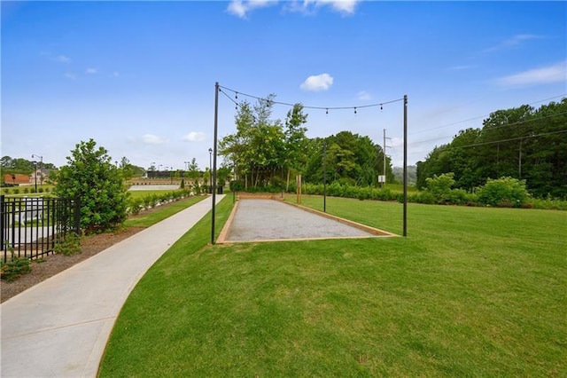 view of property's community with a yard