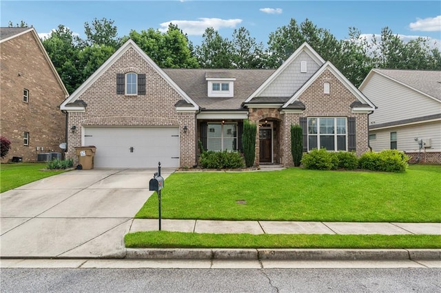 430 La Perla Dr, Sugar Hill, GA 30518 - view of front of home with brick siding, concrete driveway, a front yard, and a garage