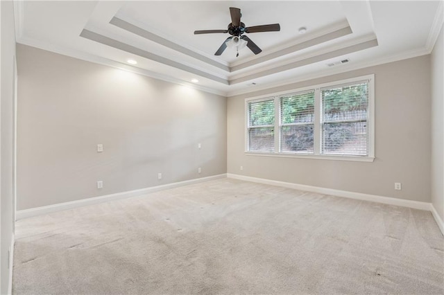 430 La Perla Dr, Sugar Hill, GA 30518 - spare room with a tray ceiling, ornamental molding, light carpet, a ceiling fan, and recessed lighting