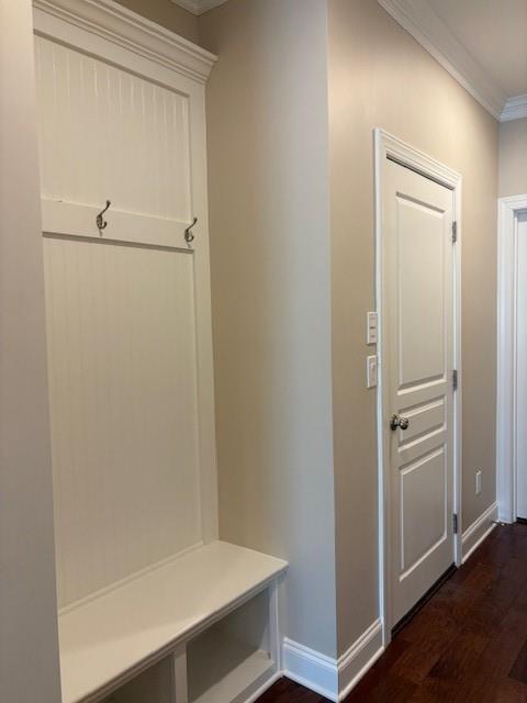 430 La Perla Dr, Sugar Hill, GA 30518 - mudroom featuring ornamental molding and dark wood-style flooring