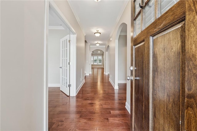 430 La Perla Dr, Sugar Hill, GA 30518 - hallway with arched walkways, ornamental molding, and dark wood-style flooring