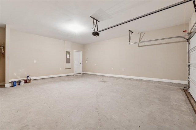 430 La Perla Dr, Sugar Hill, GA 30518 - garage featuring a garage door opener and electric panel