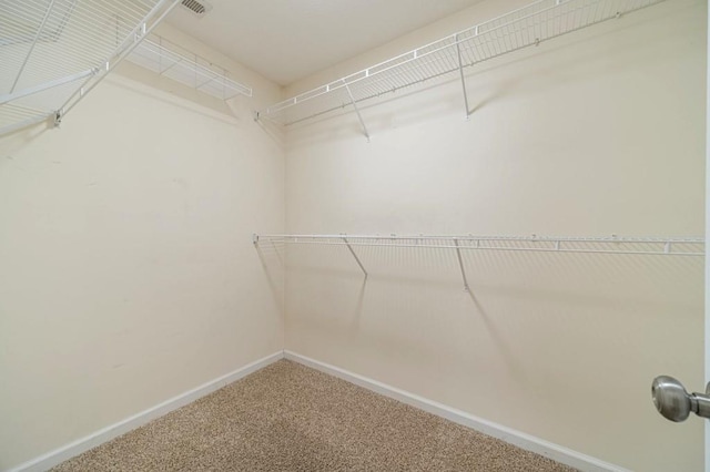 walk in closet with carpet flooring and visible vents