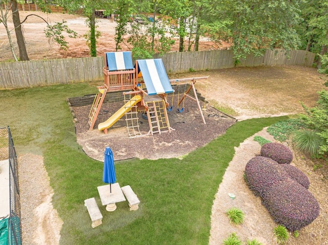 view of jungle gym with a fenced backyard and a yard