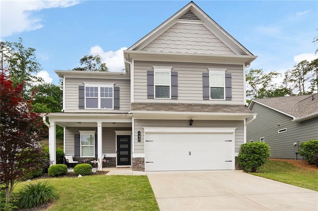 view of front facade with a garage, covered porch, driveway, and a front lawn