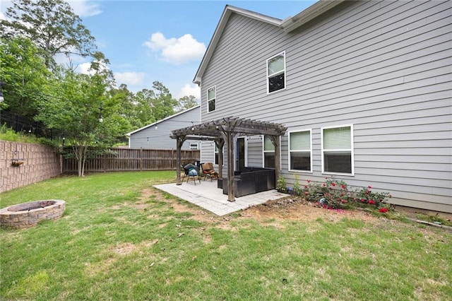 view of yard with a fenced backyard, an outdoor fire pit, a patio area, and a pergola