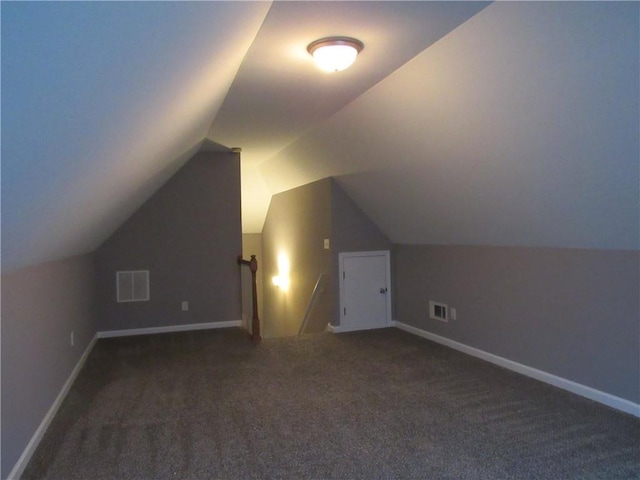 bonus room featuring carpet, visible vents, vaulted ceiling, and baseboards