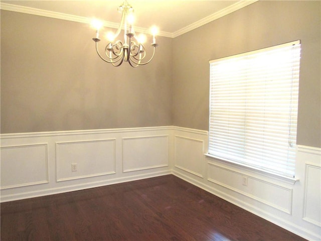 unfurnished room with a healthy amount of sunlight, a chandelier, dark wood finished floors, and wainscoting