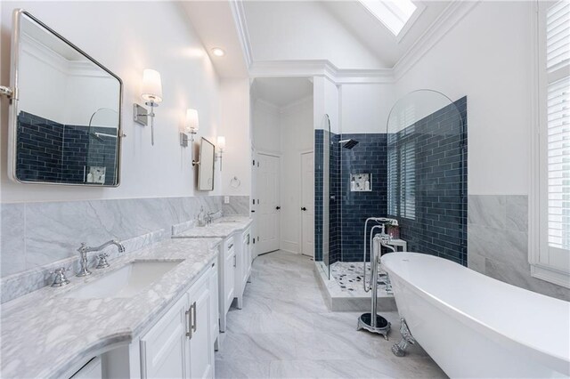 1021 Wetherby Way, Johns Creek, GA 30022 - bathroom with a stall shower, a freestanding bath, double vanity, a skylight, and tile walls