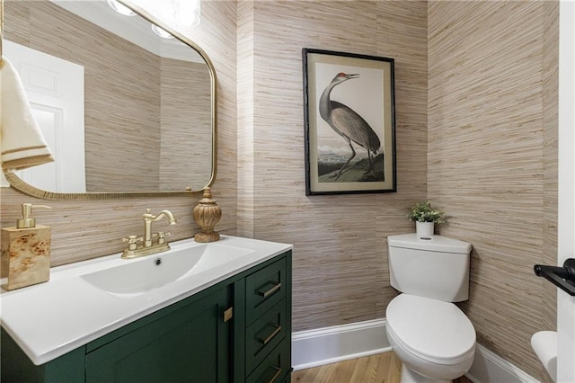 1021 Wetherby Way, Johns Creek, GA 30022 - half bath with tile walls, toilet, vanity, baseboards, and wood finished floors