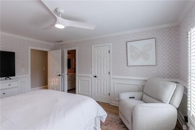 1021 Wetherby Way, Johns Creek, GA 30022 - bedroom featuring crown molding, wainscoting, wood finished floors, wallpapered walls, and ceiling fan
