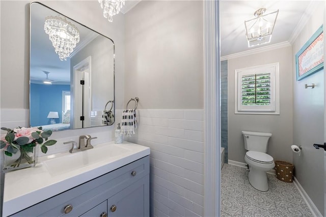 1021 Wetherby Way, Johns Creek, GA 30022 - full bathroom featuring a chandelier, crown molding, vanity, toilet, and tile walls